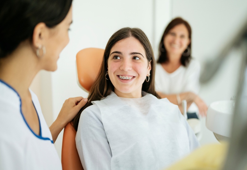 Girl smiling after her dental braces procedure in Greater Oklahoma City